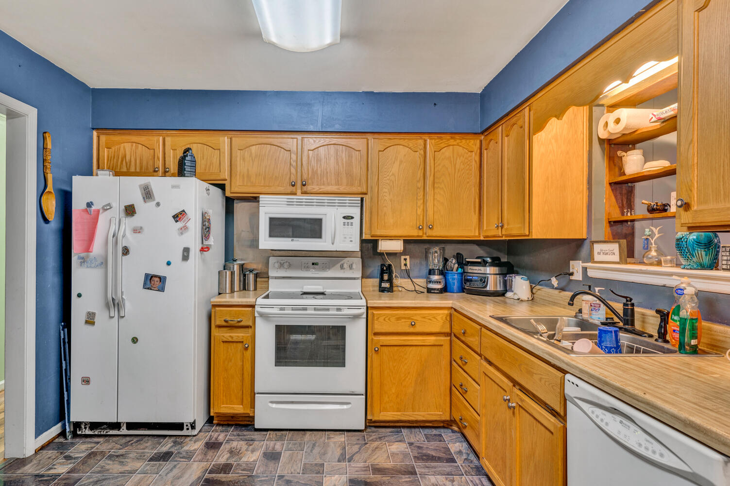 505 Holiday Road Vinton, VA 24179 - Photo 4 of 20 a kitchen with a refrigerator and sink