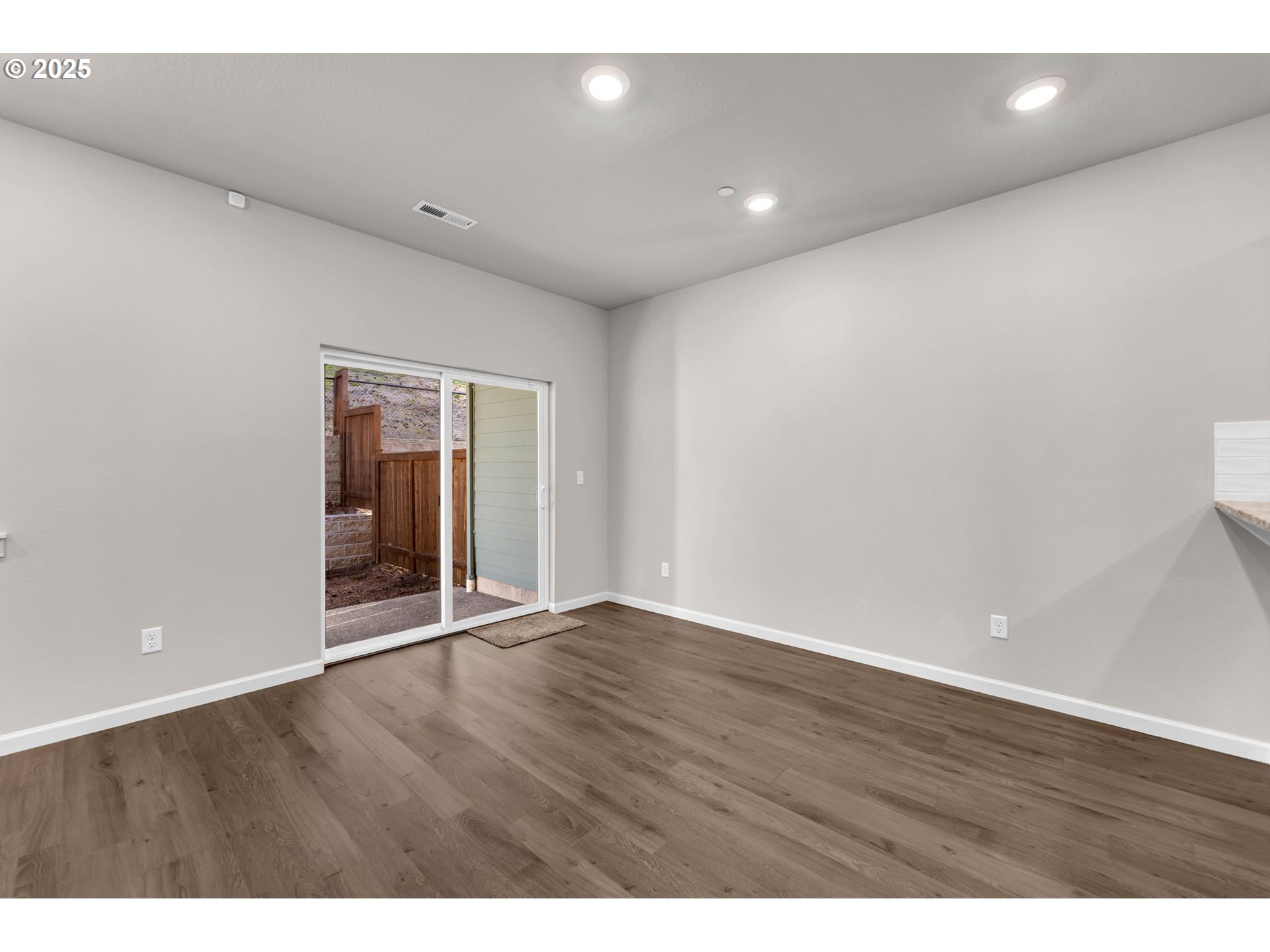 4147 South Canyon View Circle Ridgefield, WA 98642 - Photo 19 of 44 a view of an empty room with wooden floor and a window
