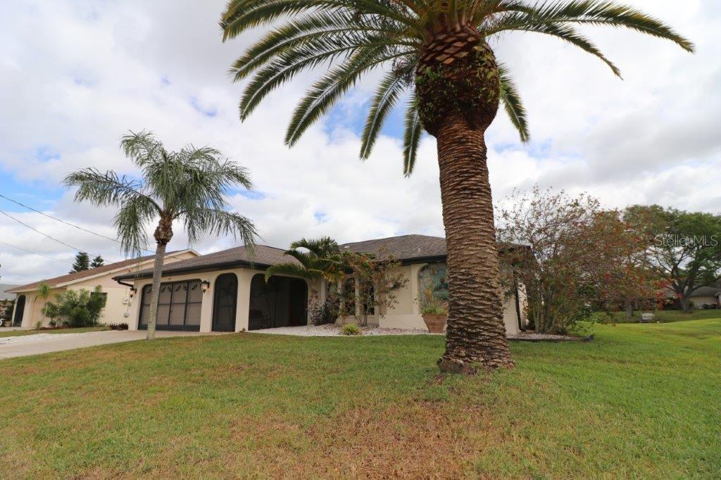 171 Bunker Road Rotonda West, FL 33947 - Photo 1 of 1 Beautiful landscaping.