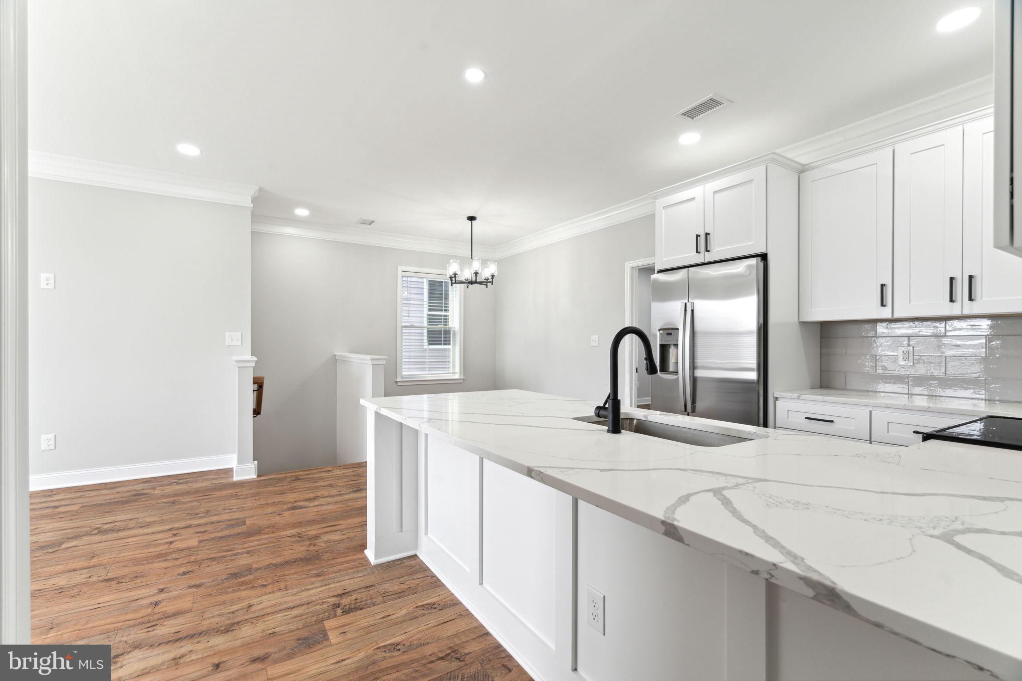48 Evergreen Lane Phoenixville, PA 19460 - Photo 13 of 42 a kitchen with kitchen island a sink appliances and cabinets