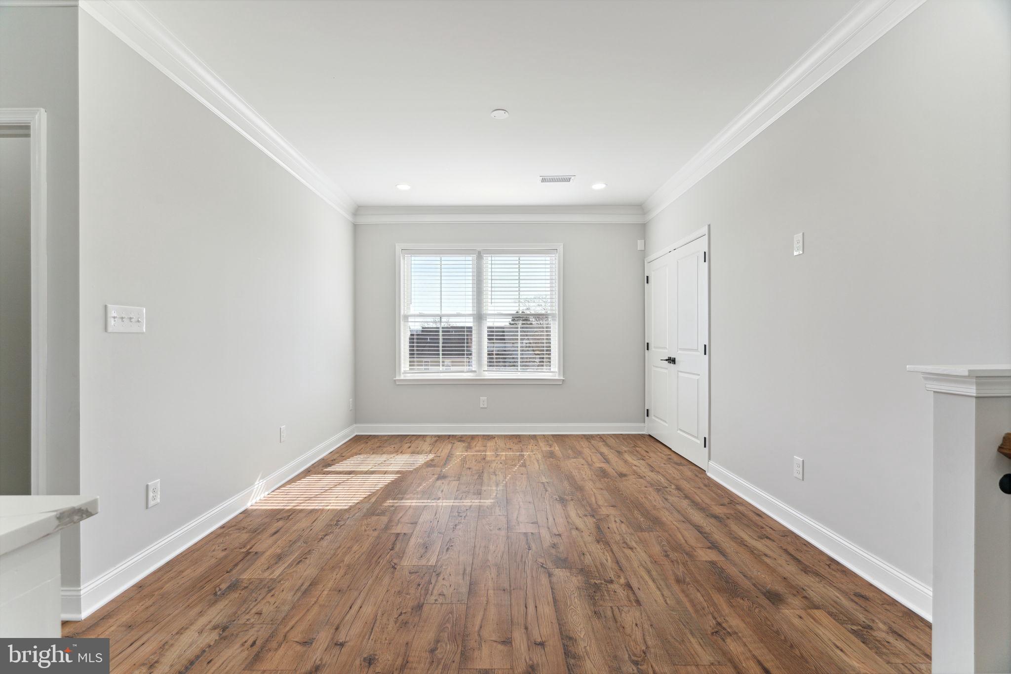 48 Evergreen Lane Phoenixville, PA 19460 - Photo 6 of 42 wooden floor in an empty room with a window