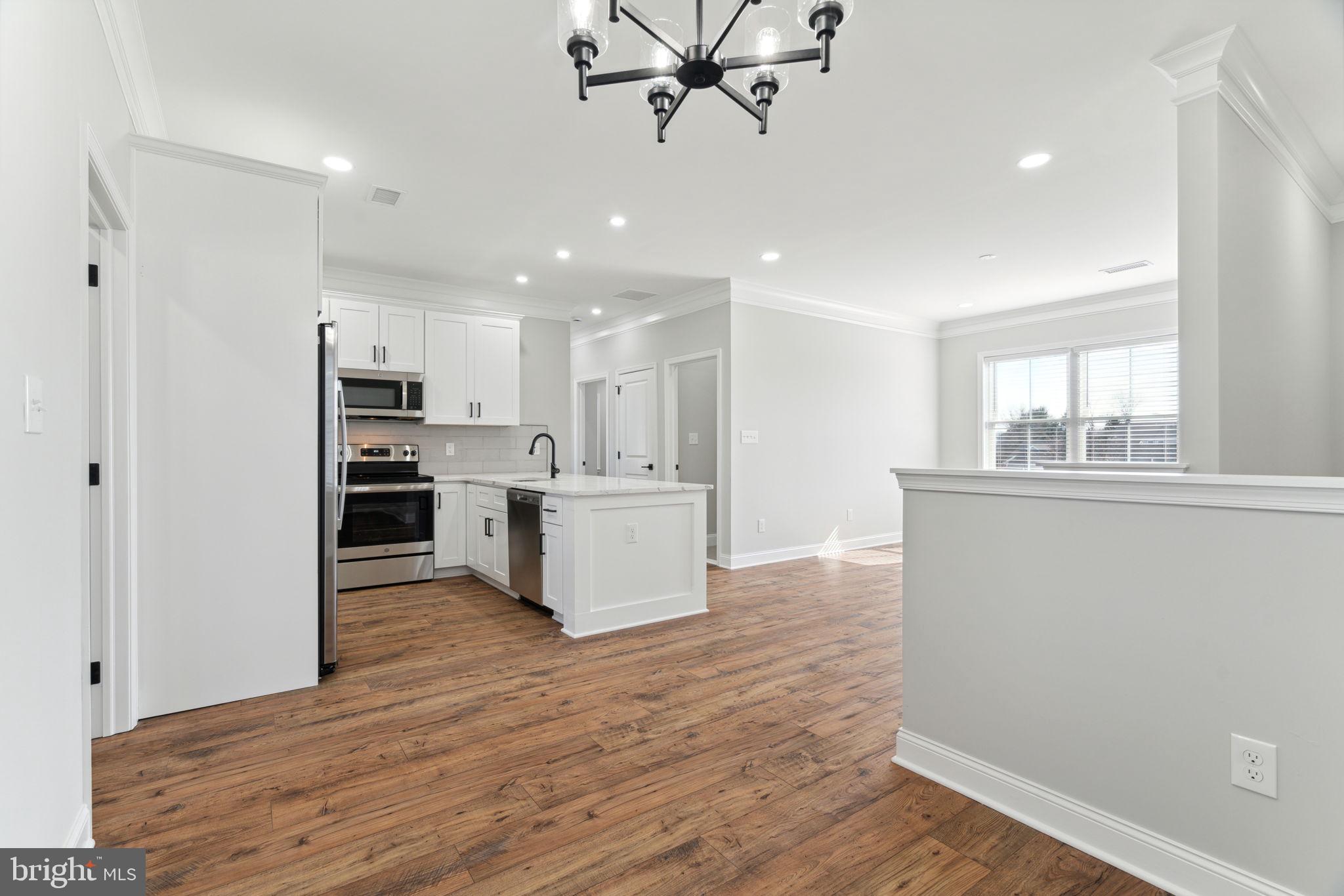 48 Evergreen Lane Phoenixville, PA 19460 - Photo 10 of 42 a view of kitchen with kitchen island wooden floor center island and appliances