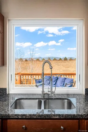a kitchen with a sink and a window