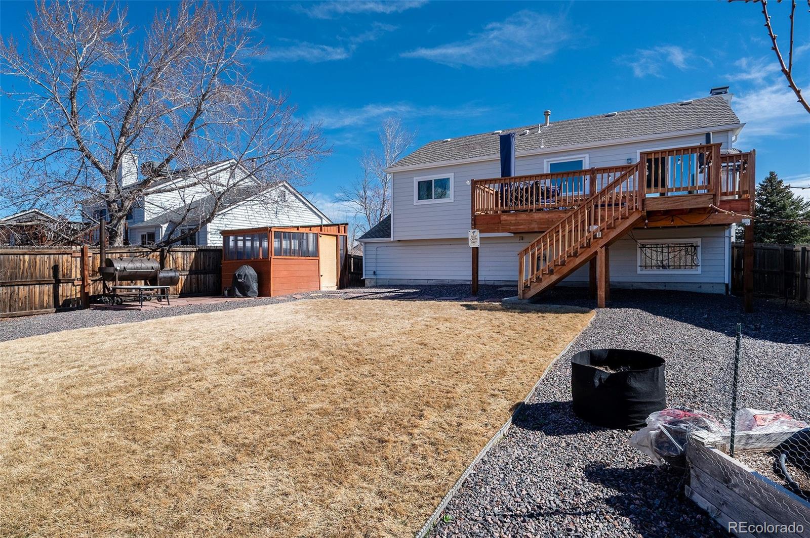 10351 Routt Street Broomfield, CO 80021 - Photo 25 of 31 a house view with a backyard space