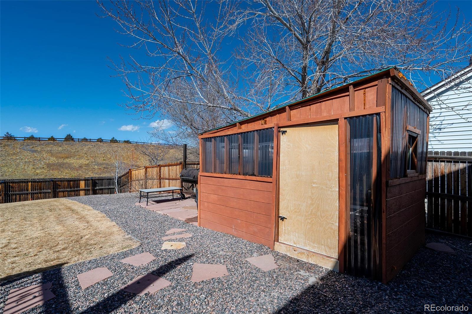 10351 Routt Street Broomfield, CO 80021 - Photo 28 of 31 a view of a backyard with seating space