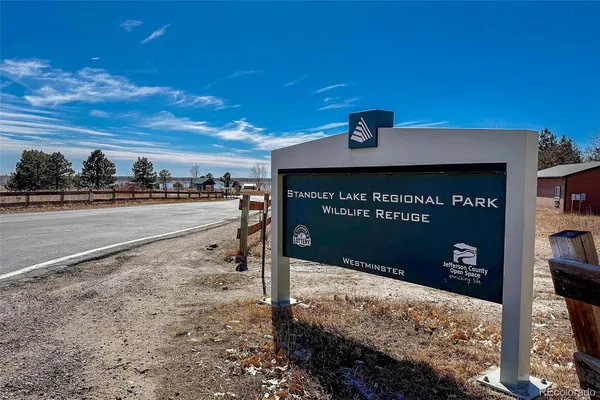 a view of a street with a building in the background