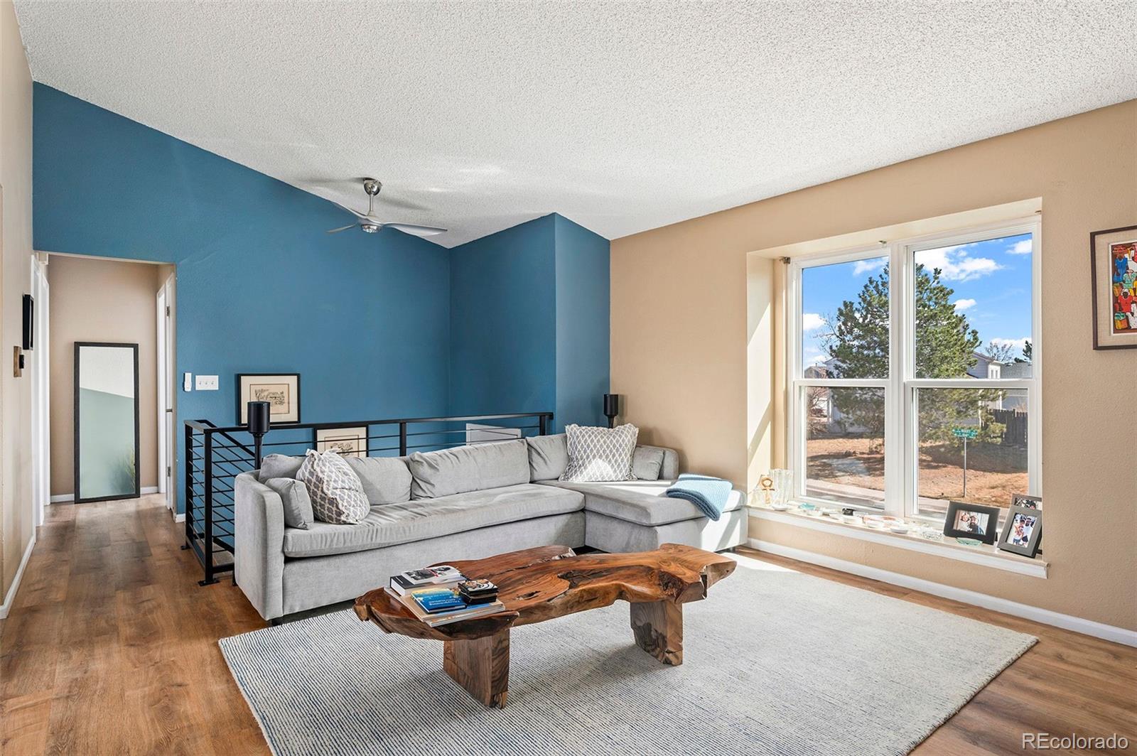 10351 Routt Street Broomfield, CO 80021 - Photo 7 of 31 a living room with furniture and a large window