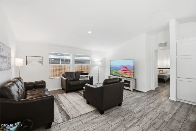 a bedroom with a fireplace and a television