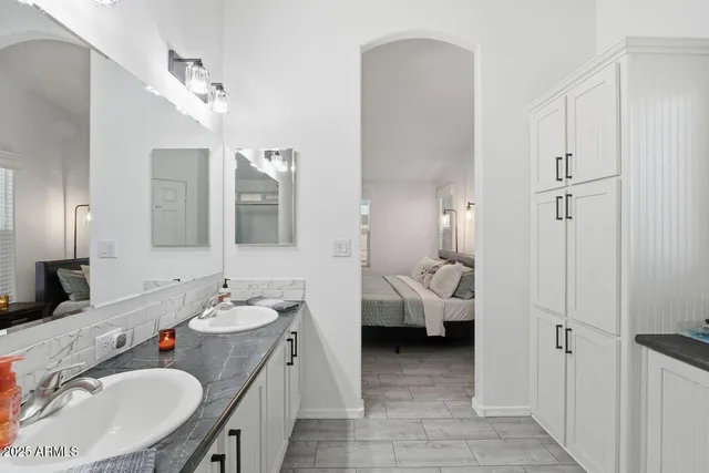 a kitchen with stainless steel appliances a sink stove and refrigerator