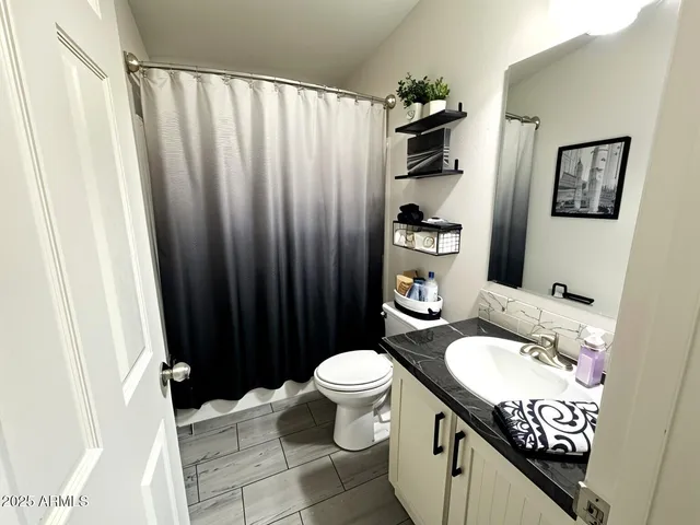 a view of a chairs and table in the patio