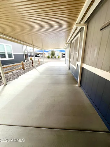 a view of a green field with an ocean