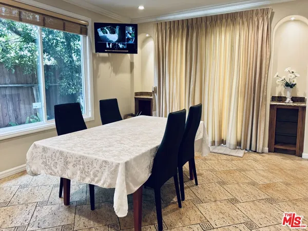 a view of a dining room with furniture window and outside view