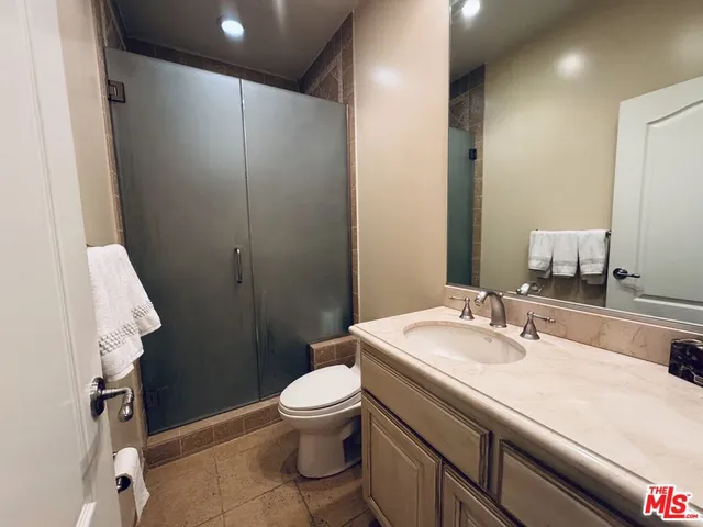 a bathroom with a sink toilet and vanity