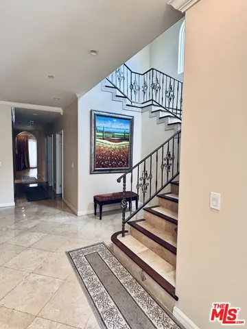 a view of staircase with white walls