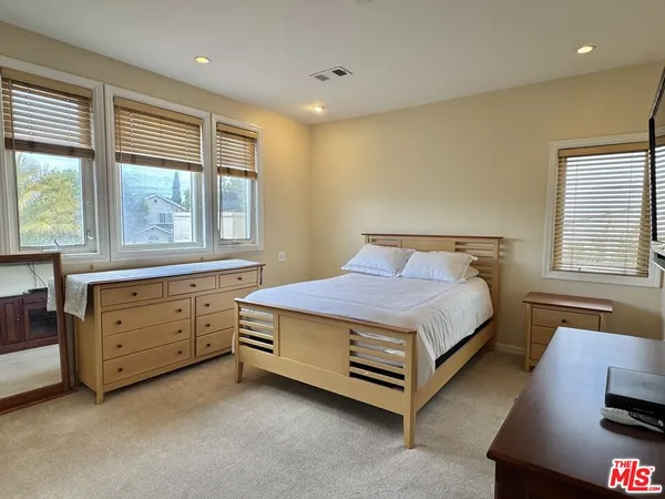 a bed room with a bed and a window