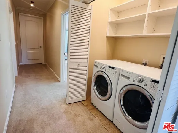 a view of a room with washer and dryer