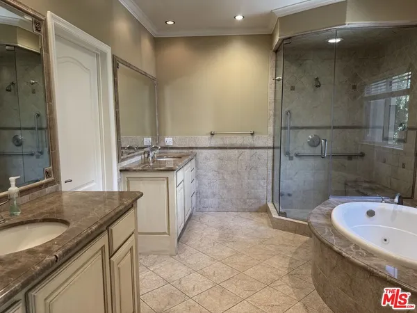 a bathroom with a granite countertop sink a toilet and bathtub
