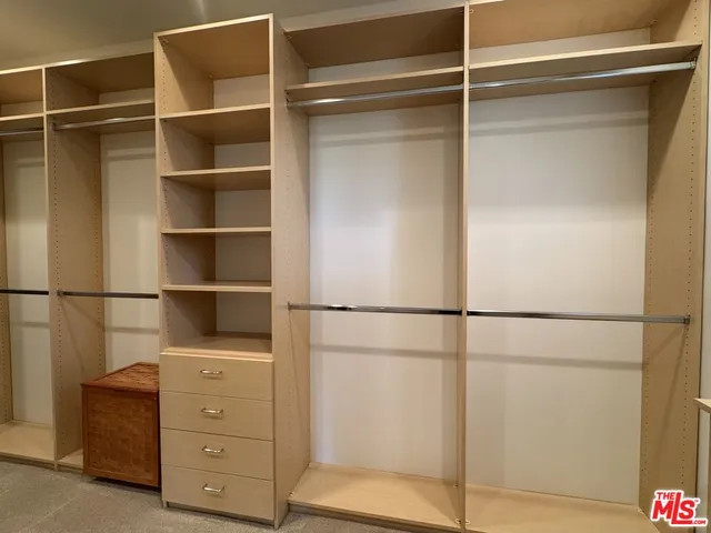 a view of an empty walk in closet