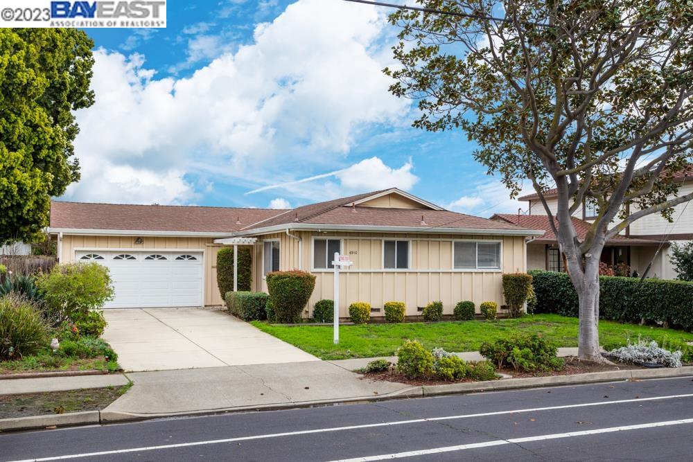 6910 Cedar Boulevard Newark, CA 94560 - Photo 1 of 1 a front view of a house with a garden