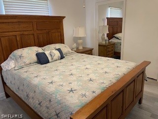 11731 Iona Road Fort Myers, FL 33908 - Photo 11 of 26 a bedroom with a bed and dresser