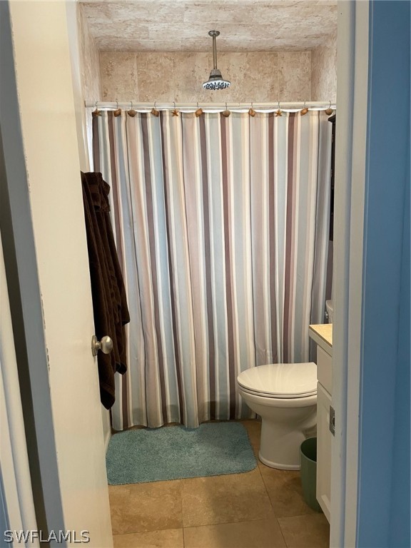 11731 Iona Road Fort Myers, FL 33908 - Photo 15 of 26 a bathroom with a toilet and a mirror