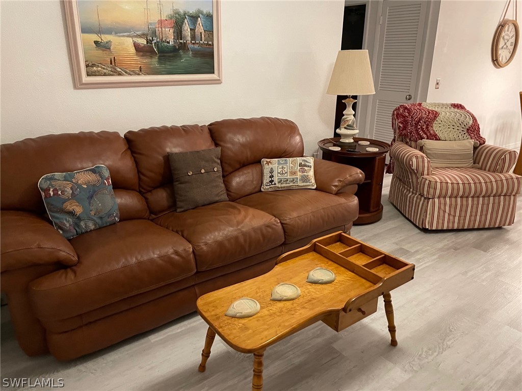 11731 Iona Road Fort Myers, FL 33908 - Photo 3 of 26 a living room with furniture and a couch