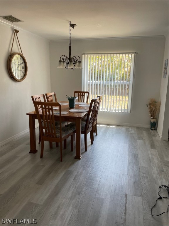 11731 Iona Road Fort Myers, FL 33908 - Photo 5 of 26 a view of a dining room with furniture window and wooden floor