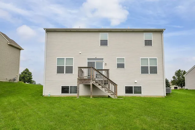 a house that has a big yard in front of it