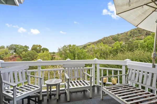 a view of a chairs and table on the terrace