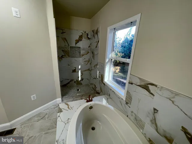 a bathroom with a sink and a bathtub