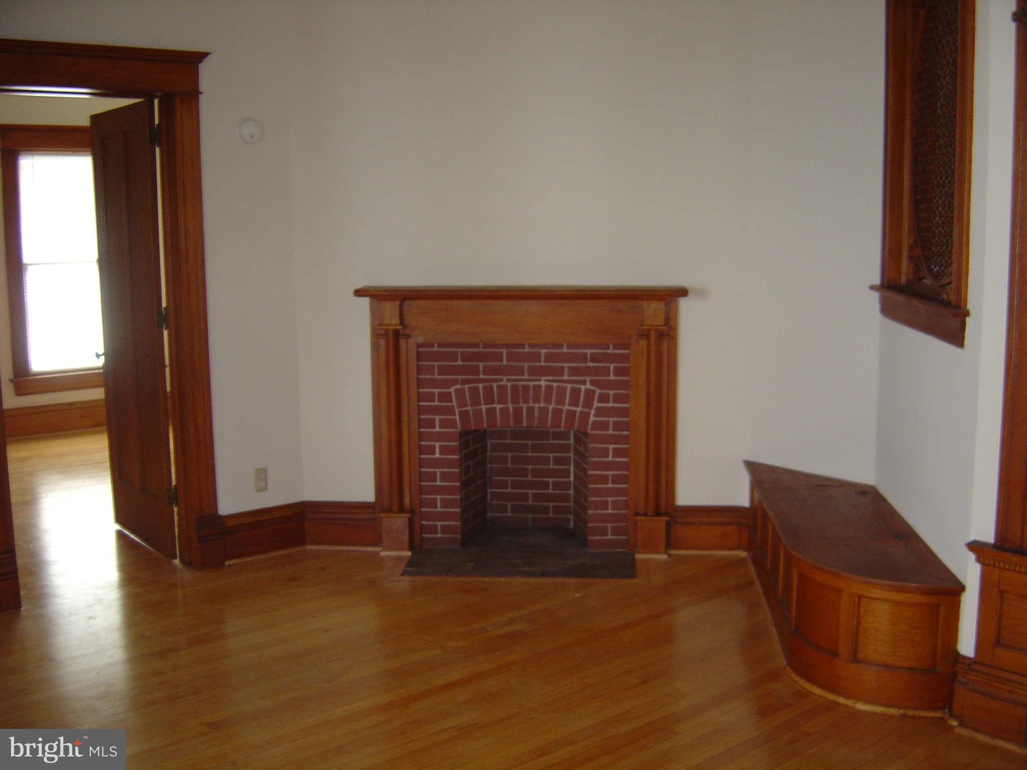 305 Main Street New Windsor, MD 21776 - Photo 16 of 30 a view of an empty room with wooden floor and a window