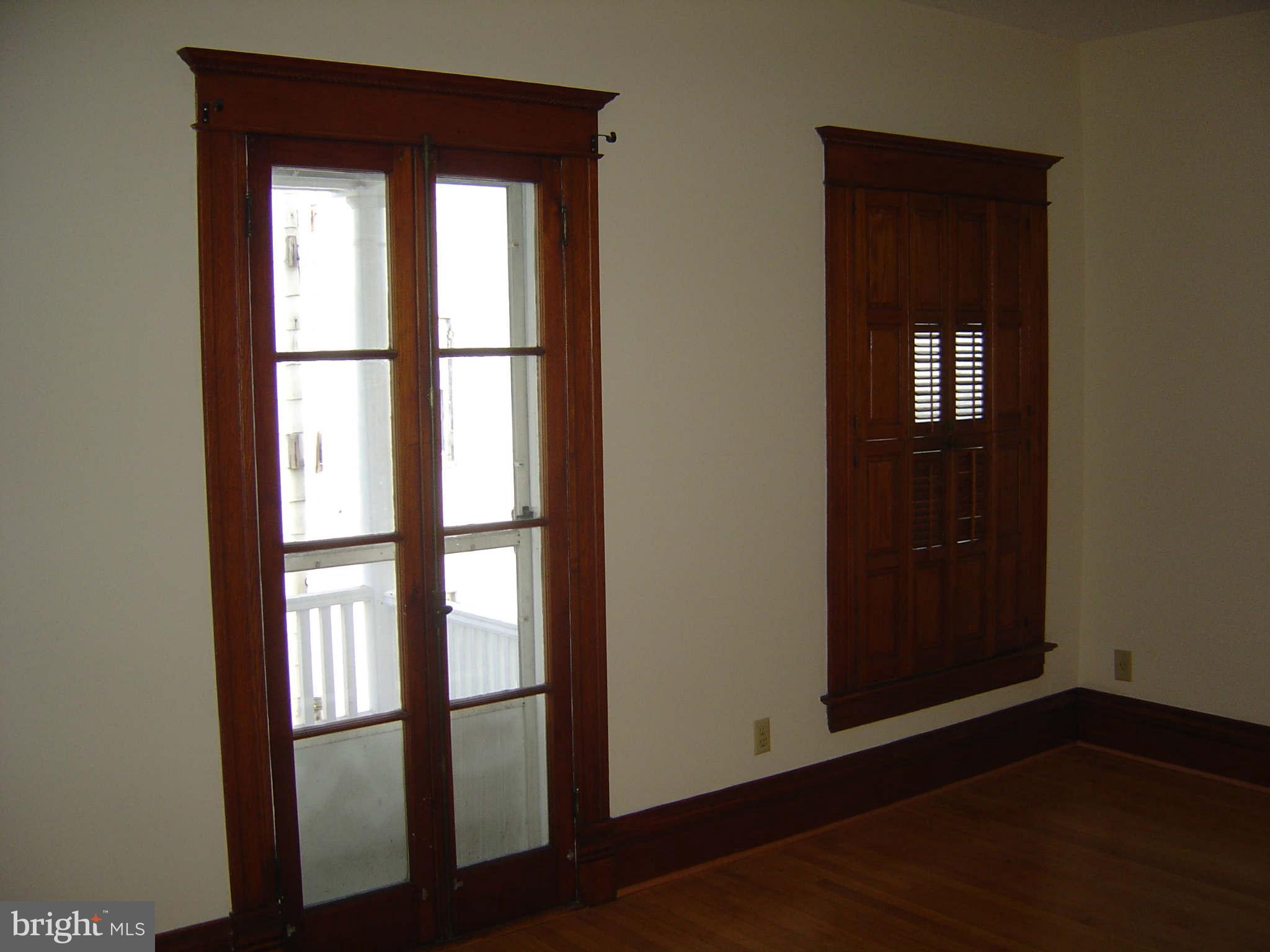305 Main Street New Windsor, MD 21776 - Photo 17 of 30 an empty room with wooden floor and windows