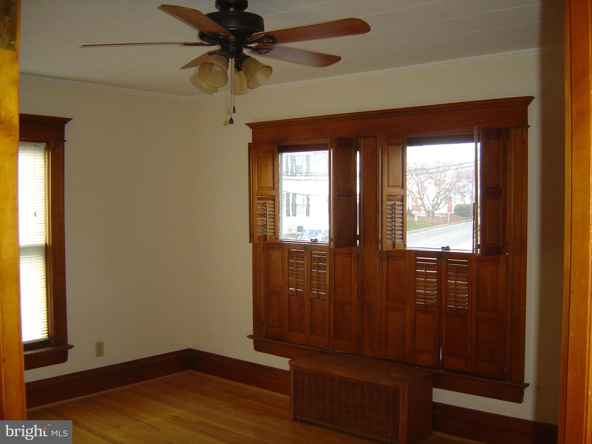 305 Main Street New Windsor, MD 21776 - Photo 26 of 30 a view of a hallway with wooden floor and windows