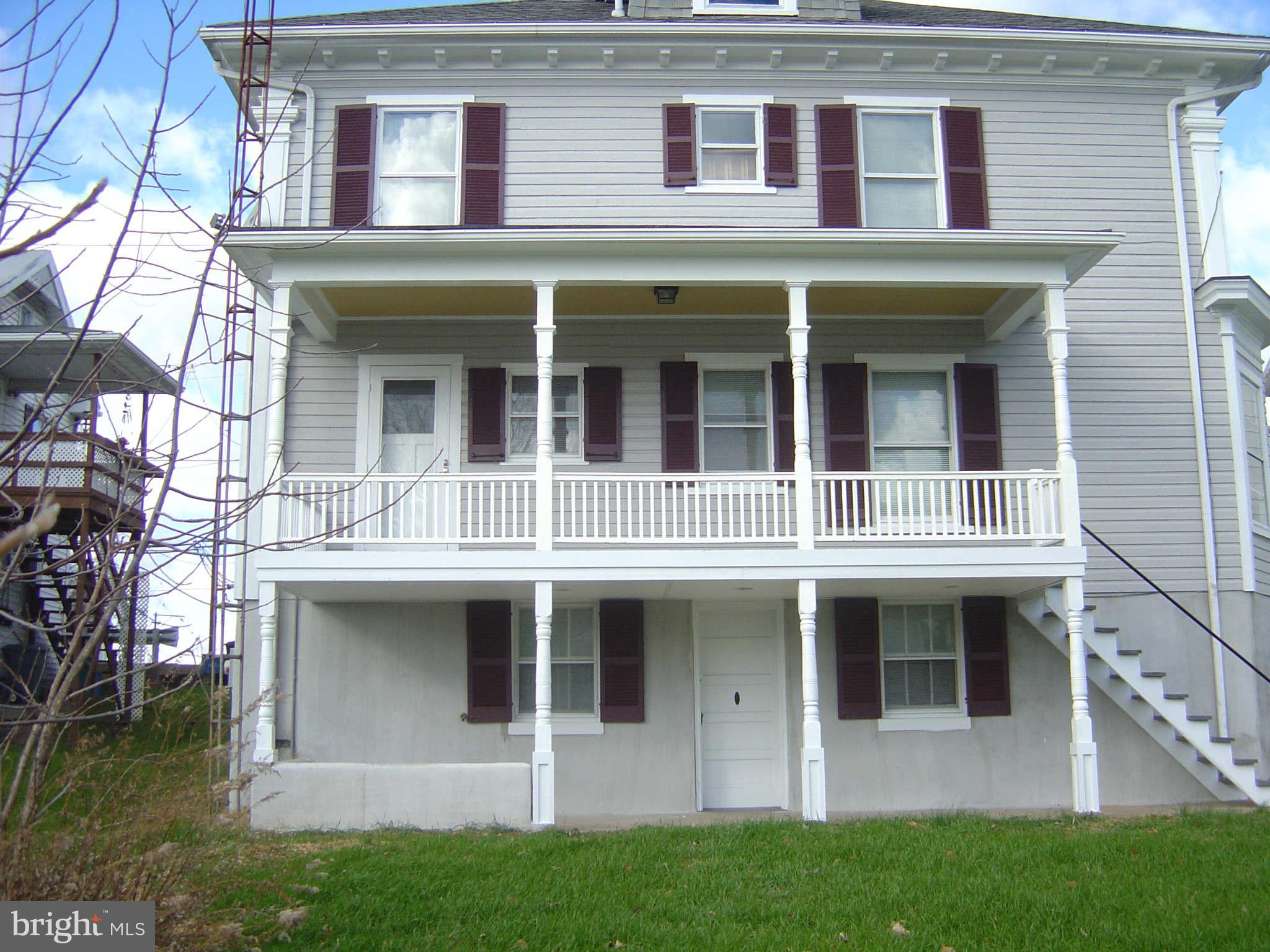 305 Main Street New Windsor, MD 21776 - Photo 28 of 30 a front view of a house with a yard