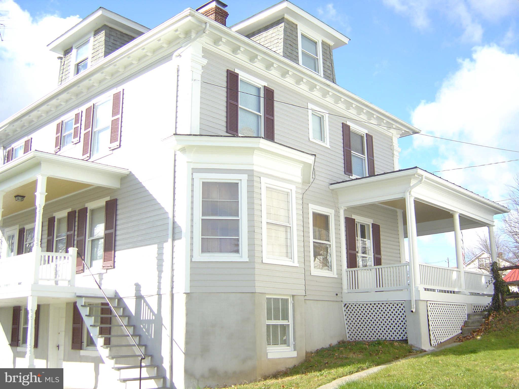 305 Main Street New Windsor, MD 21776 - Photo 6 of 30 a view of white house with a yard