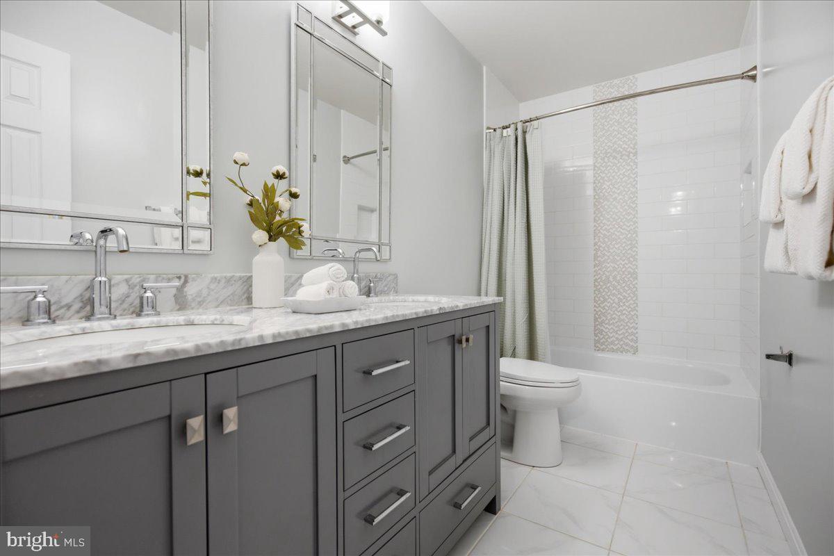 2424 Springbrook Court Huntingtown, MD 20639 - Photo 67 of 103 a bathroom with a granite countertop sink toilet and shower