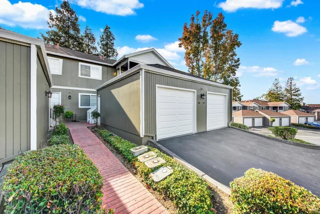 a view of balcony with wooden floor and fence