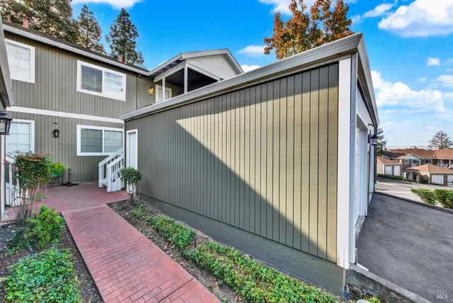 a terrace view with glass windows and garden view