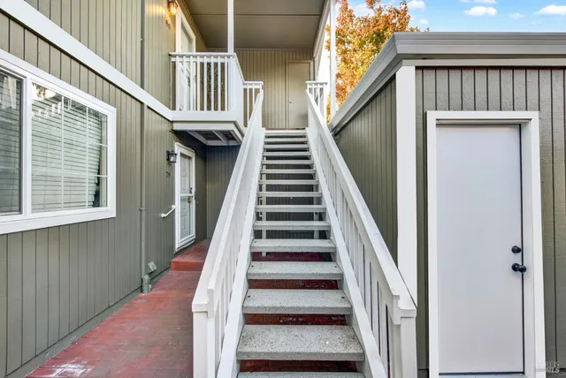 a living room with furniture pool table and a flat screen tv