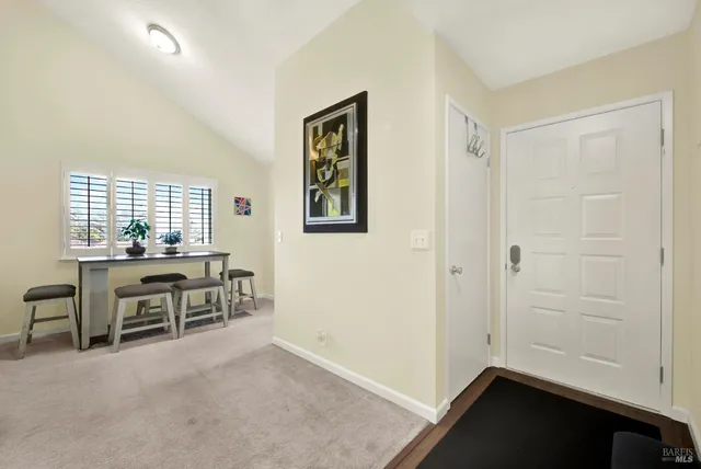 a view of a livingroom with a flat screen tv and a fireplace