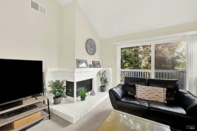 a kitchen with granite countertop a sink a stove and cabinets