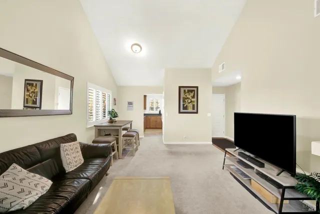 a kitchen with a refrigerator and a stove