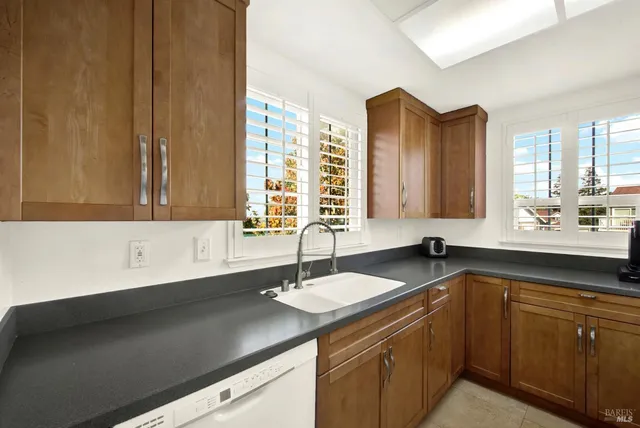 a bedroom with a bed a mirror and furniture