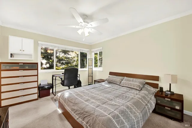 a balcony with wooden floor and fence