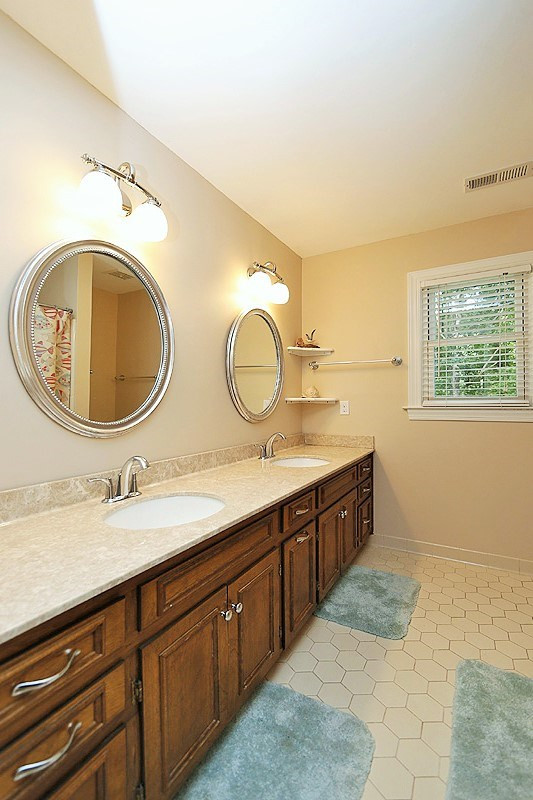11021 Coachmans Way Raleigh, NC 27614 - Photo 15 of 24 The full bathroom on the second floor has updated counters and hardware, and plenty of room for sharing! Bathroom