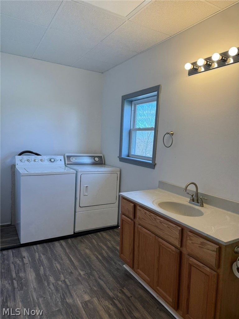 23033 Cadiz Road Freeport, OH 43973 - Photo 27 of 31 Laundry area featuring dark wood-style floors and washer and clothes dryer