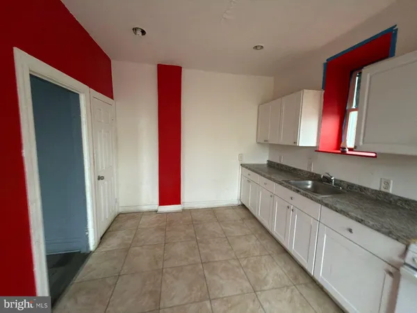 a kitchen with stainless steel appliances granite countertop a stove and a sink