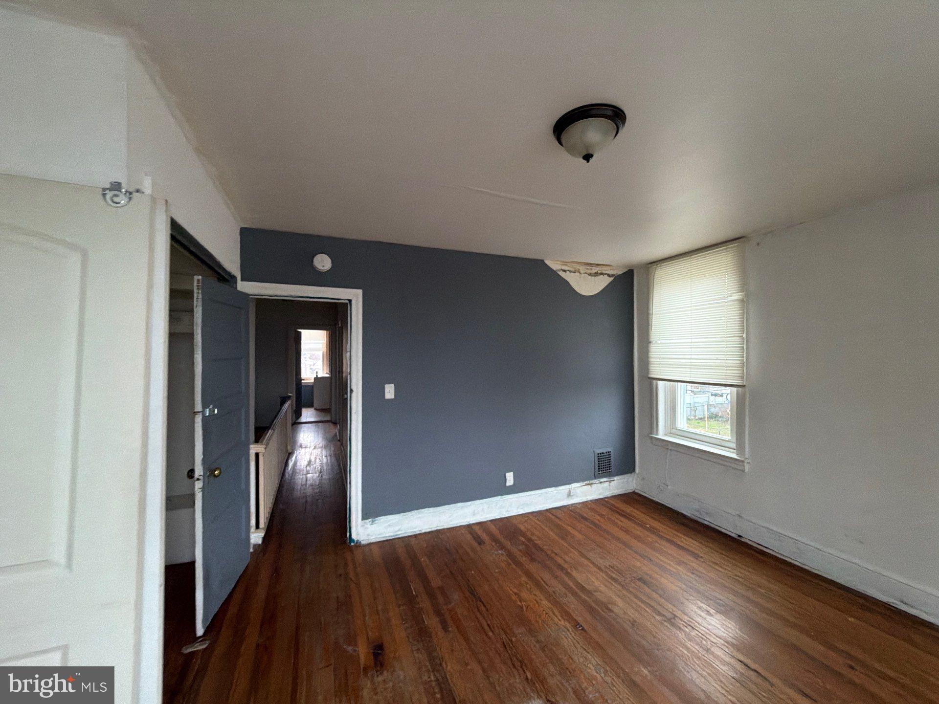 800 West 11th Street Chester, PA 19013 - Photo 10 of 17 wooden floor in an empty room with a window