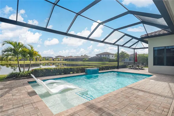 a living room with furniture and a chair