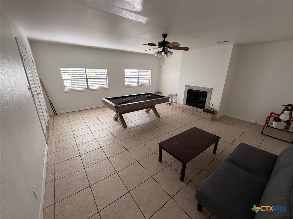 3504 Erwin Avenue Victoria, TX 77901 - Photo 11 of 16 a living room with furniture and a fireplace